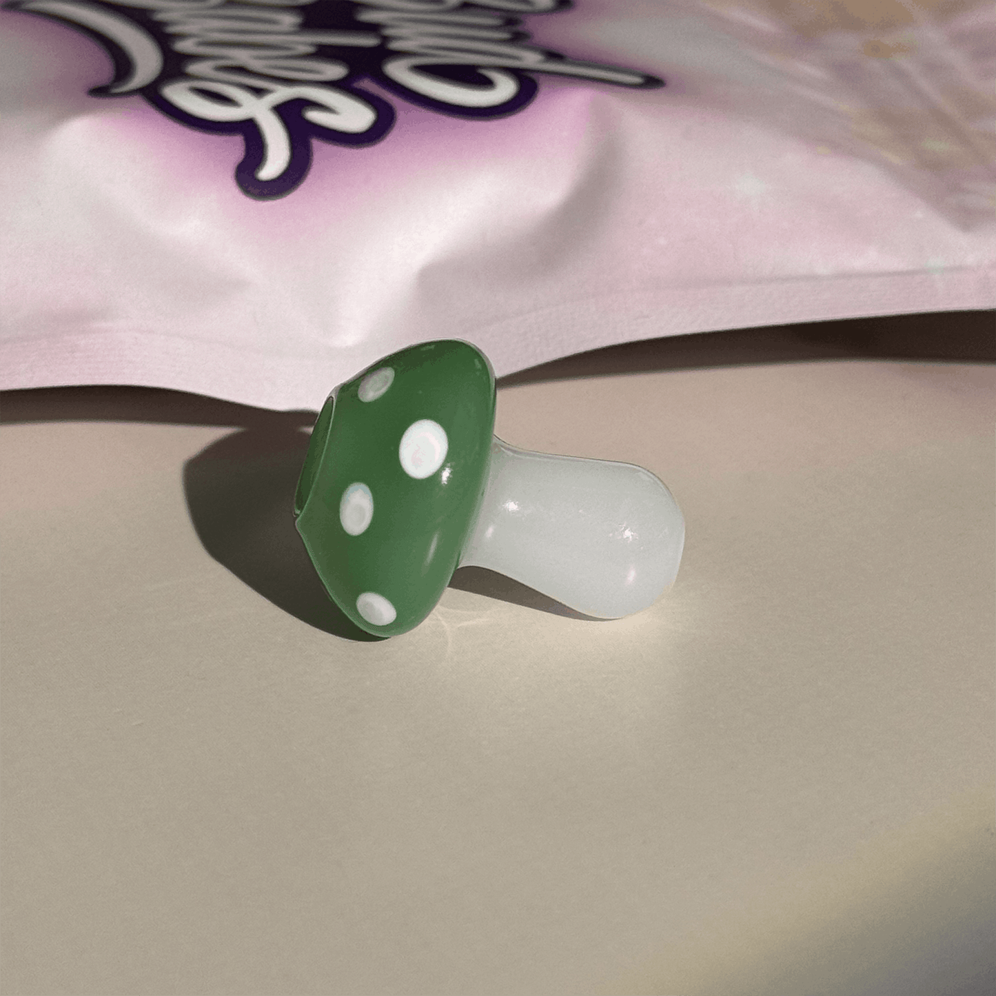 Handmade magic mushroom glass joint holder by BudBabes, lifestyle product shot