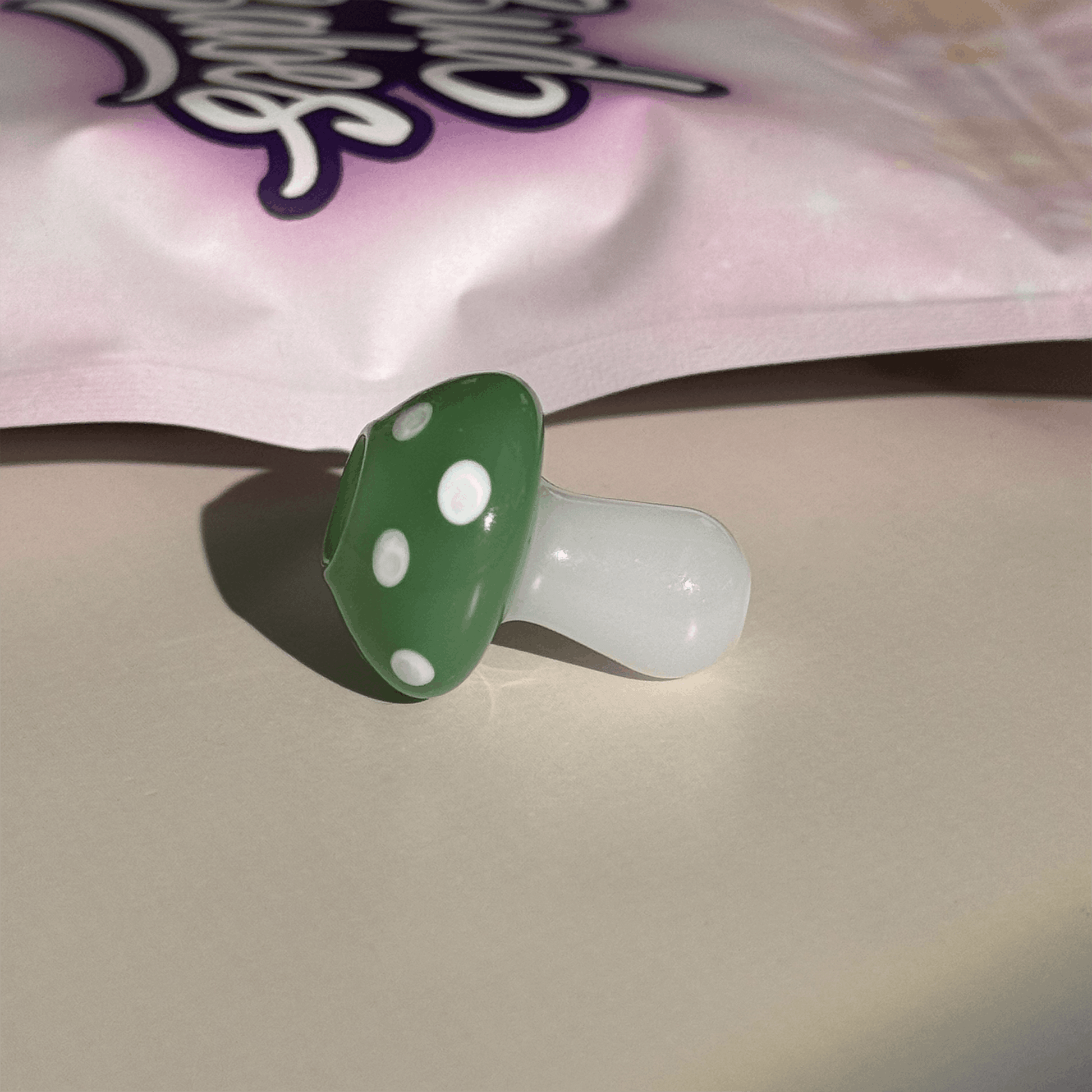 Handmade magic mushroom glass joint holder by BudBabes, lifestyle product shot